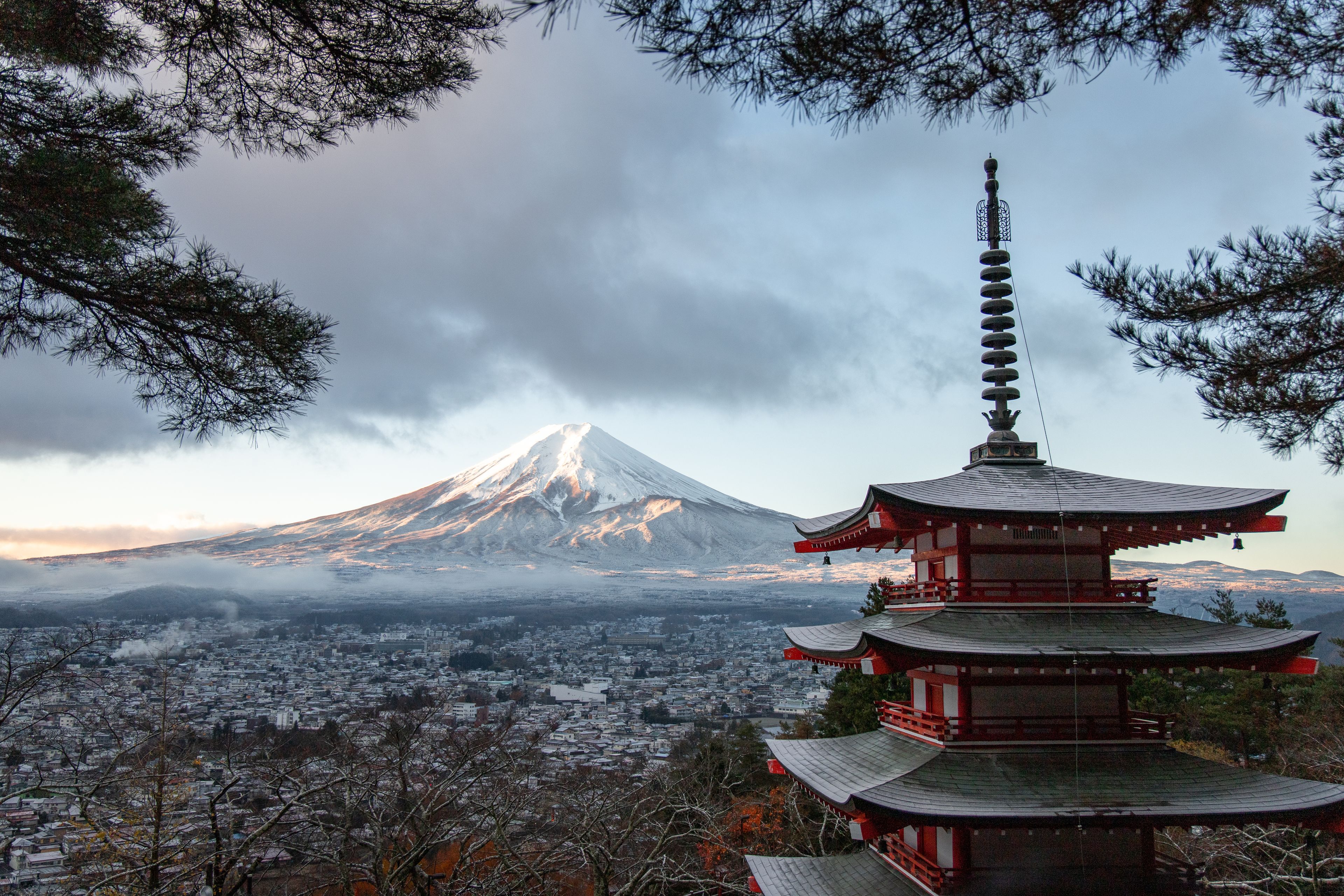 Chureito Pagoda with snow-capped Mt. Fuji rising above the clouds, Japan