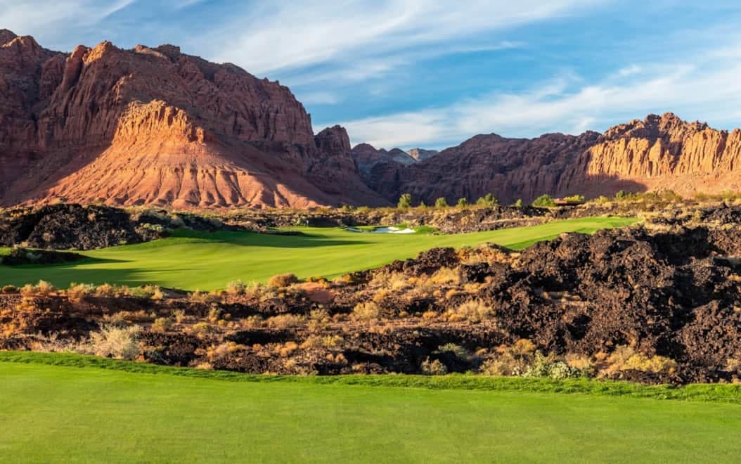 Las Vegas area desert golf — green fairways against volcanic red rock formations